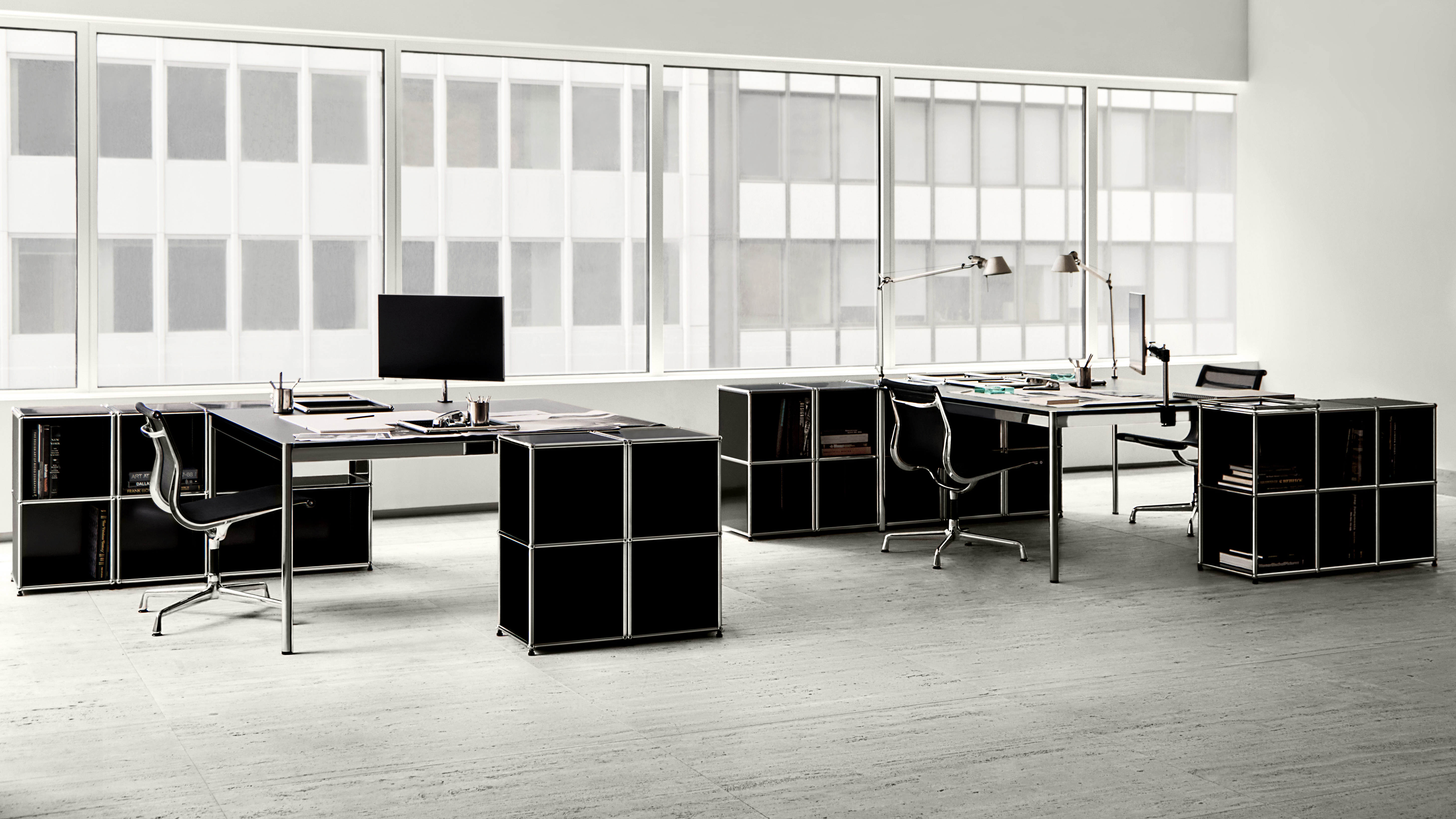 Black and white office furnished with USM Haller system